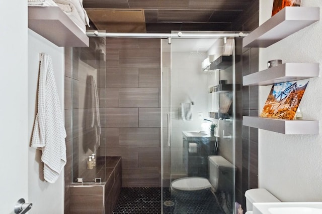 1601 E Cesar Chavez St Unit 202, Austin, TX 78702 - bathroom with a stall shower and tile patterned flooring