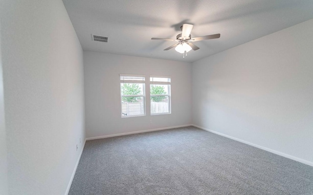 201 Lt Rusty Dr, Jarrell, TX 76537 - spare room featuring carpet flooring, baseboards, and a ceiling fan