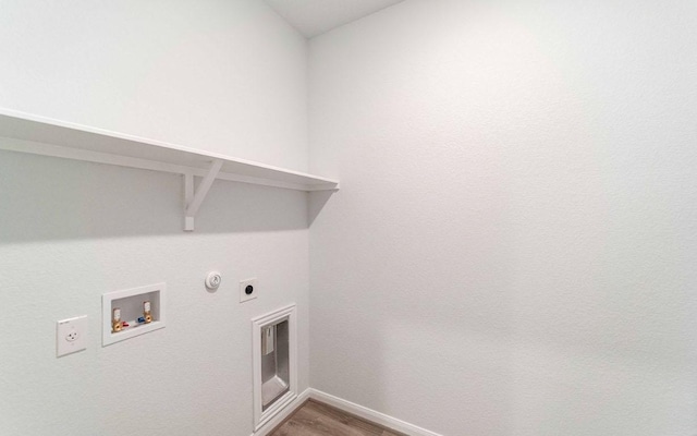 201 Lt Rusty Dr, Jarrell, TX 76537 - washroom with electric dryer hookup, hookup for a gas dryer, washer hookup, baseboards, and wood finished floors