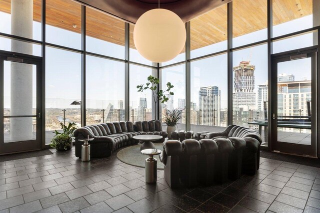 44 E Ave Unit 2601, Austin, TX 78701 - lobby with floor to ceiling windows and a skyline view