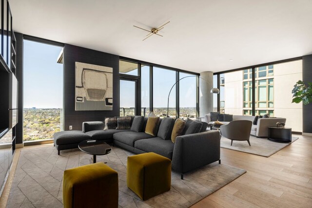 44 E Ave Unit 2601, Austin, TX 78701 - living room with floor to ceiling windows and wood finished floors