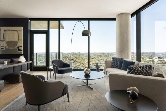 44 E Ave Unit 2601, Austin, TX 78701 - living room with expansive windows and wood finished floors