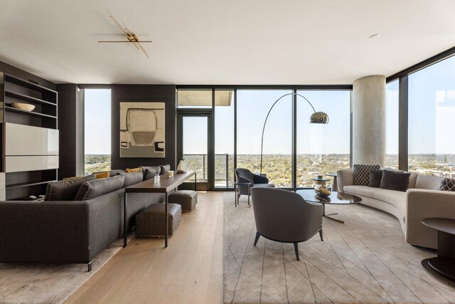 44 E Ave Unit 2601, Austin, TX 78701 - living room with expansive windows and wood finished floors