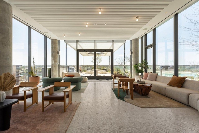 44 E Ave Unit 2601, Austin, TX 78701 - sunroom featuring expansive windows and carpet flooring