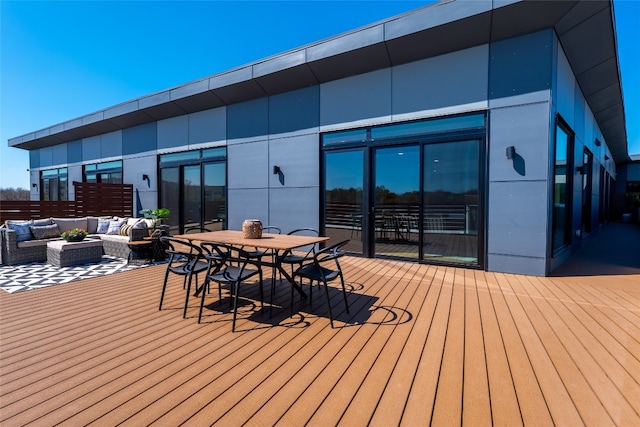 2209 S 1st St Unit 407, Austin, TX 78704 - wooden deck featuring an outdoor living space and outdoor dining space