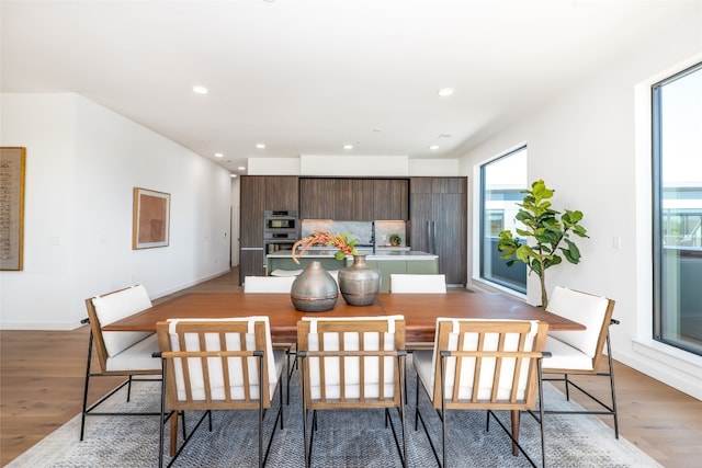 2209 S 1st St Unit 407, Austin, TX 78704 - dining room featuring light wood-type flooring and recessed lighting