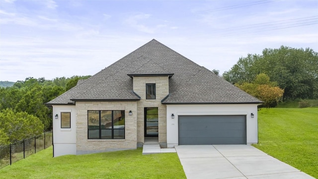 1304 Novara Trl, Leander, TX 78641 - view of front of property featuring a shingled roof, a garage, concrete driveway, and stone siding