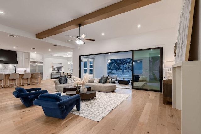 10928 Seawall Dr, Austin, TX 78737 - living area featuring light wood-style floors, beam ceiling, ceiling fan, and recessed lighting