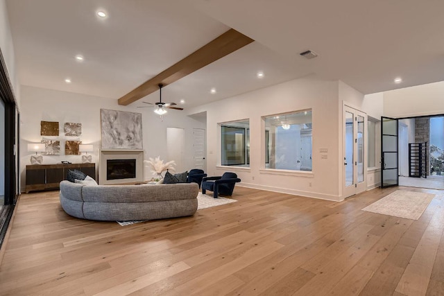 10928 Seawall Dr, Austin, TX 78737 - living area featuring a ceiling fan, beamed ceiling, light wood-style floors, a fireplace, and recessed lighting