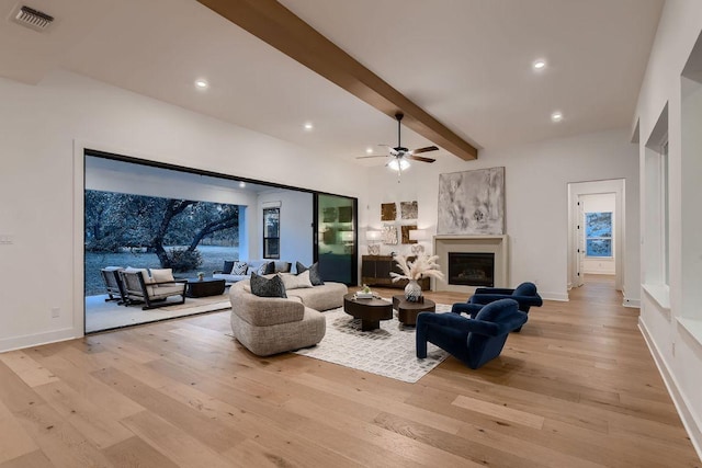 10928 Seawall Dr, Austin, TX 78737 - living area with light wood-style flooring, beam ceiling, recessed lighting, ceiling fan, and a fireplace