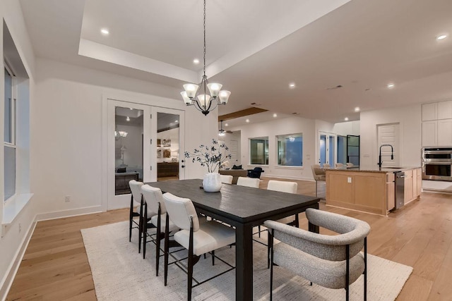 10928 Seawall Dr, Austin, TX 78737 - dining room with light wood-type flooring, a chandelier, and recessed lighting