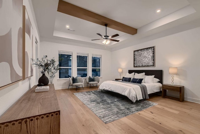 10928 Seawall Dr, Austin, TX 78737 - bedroom featuring wood-type flooring, a raised ceiling, ceiling fan, recessed lighting, and beamed ceiling
