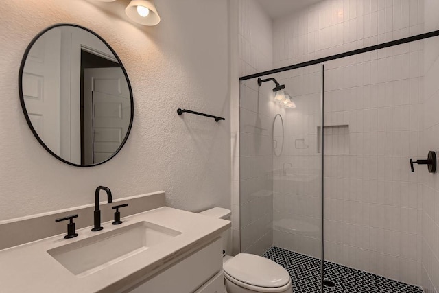 10928 Seawall Dr, Austin, TX 78737 - bathroom featuring a shower stall, vanity, and a textured wall