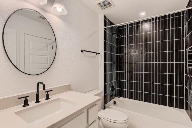 10928 Seawall Dr, Austin, TX 78737 - bathroom featuring vanity,  shower combination, and a textured wall