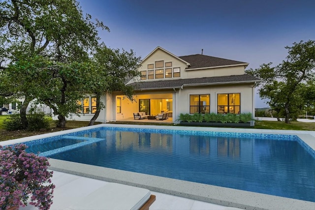 10928 Seawall Dr, Austin, TX 78737 - back of house featuring stucco siding, an outdoor living space, an outdoor pool, roof with shingles, and a patio