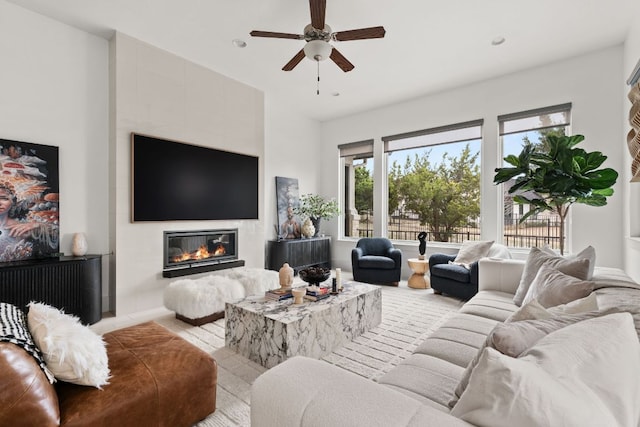 702 Serene Estates Dr, Austin, TX 78738 - living room featuring ceiling fan, a tiled fireplace, and recessed lighting