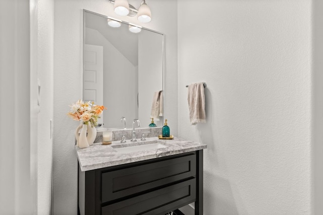 702 Serene Estates Dr, Austin, TX 78738 - bathroom with vanity and a textured wall