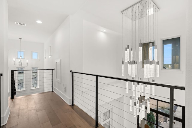 702 Serene Estates Dr, Austin, TX 78738 - hallway featuring wood finished floors, baseboards, a towering ceiling, and recessed lighting