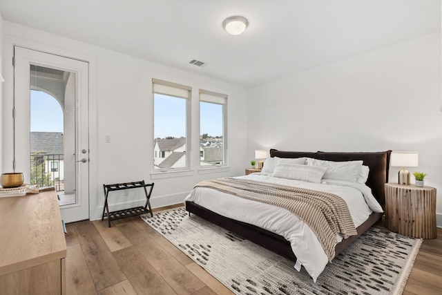 702 Serene Estates Dr, Austin, TX 78738 - bedroom featuring light wood finished floors, access to exterior, and baseboards