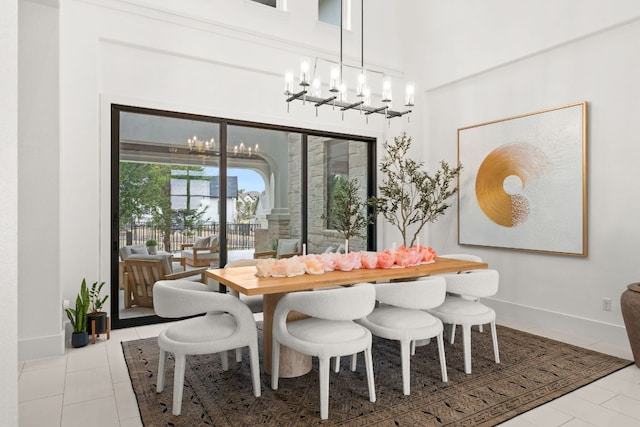 702 Serene Estates Dr, Austin, TX 78738 - tiled dining room featuring a chandelier, baseboards, and a high ceiling