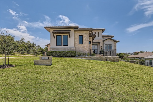 702 Serene Estates Dr, Austin, TX 78738 - view of front of house with stone siding, a front lawn, a tile roof, and stucco siding