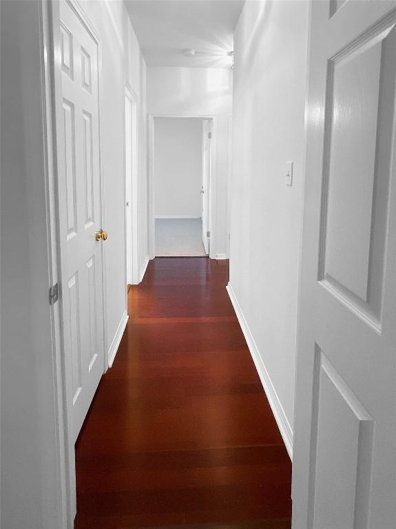 2804 Butler National Dr, Pflugerville, TX 78660 - hall with dark wood finished floors and baseboards