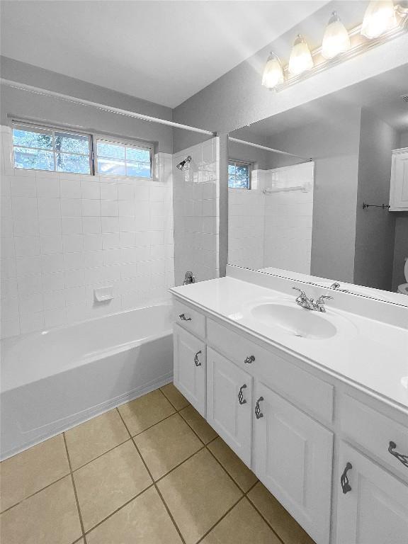 2804 Butler National Dr, Pflugerville, TX 78660 - bathroom with tile patterned floors, shower / bathtub combination, and vanity