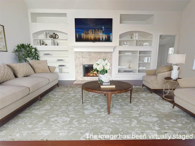 2804 Butler National Dr, Pflugerville, TX 78660 - living room featuring built in features and a tiled fireplace