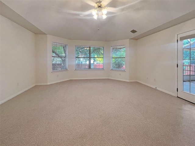 2804 Butler National Dr, Pflugerville, TX 78660 - spare room featuring ceiling fan, light carpet, and baseboards