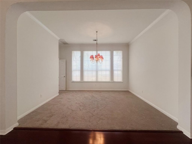 2804 Butler National Dr, Pflugerville, TX 78660 - carpeted spare room featuring crown molding, a chandelier, arched walkways, and baseboards