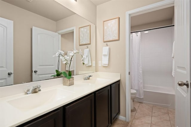 122 Denton Dr, Hutto, TX 78634 - bathroom with tile patterned floors, toilet, double vanity, and a sink
