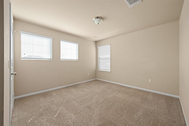 122 Denton Dr, Hutto, TX 78634 - unfurnished room featuring visible vents, carpet floors, and baseboards