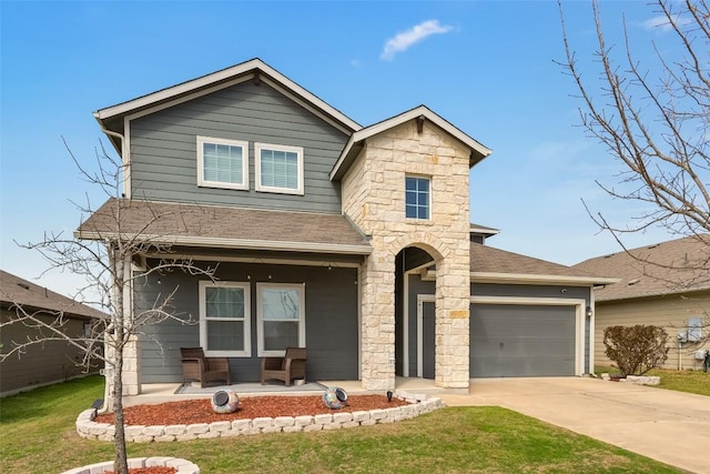 122 Denton Dr, Hutto, TX 78634 - traditional-style home with driveway, covered porch, roof with shingles, and stone siding