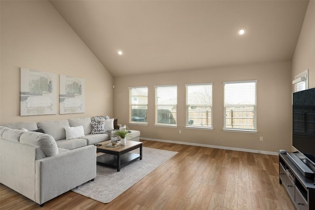 122 Denton Dr, Hutto, TX 78634 - living area with recessed lighting, baseboards, plenty of natural light, and light wood finished floors