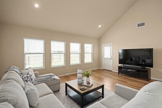 122 Denton Dr, Hutto, TX 78634 - living area with light wood finished floors, visible vents, recessed lighting, and baseboards
