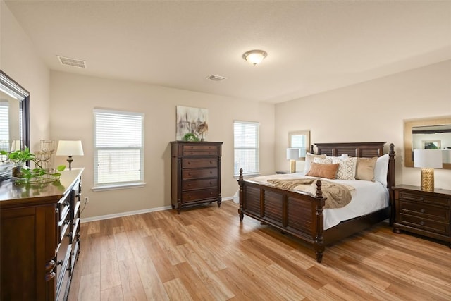 122 Denton Dr, Hutto, TX 78634 - bedroom featuring visible vents, baseboards, and light wood-style flooring