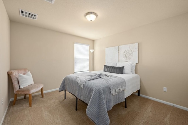 122 Denton Dr, Hutto, TX 78634 - bedroom with visible vents, carpet floors, and baseboards