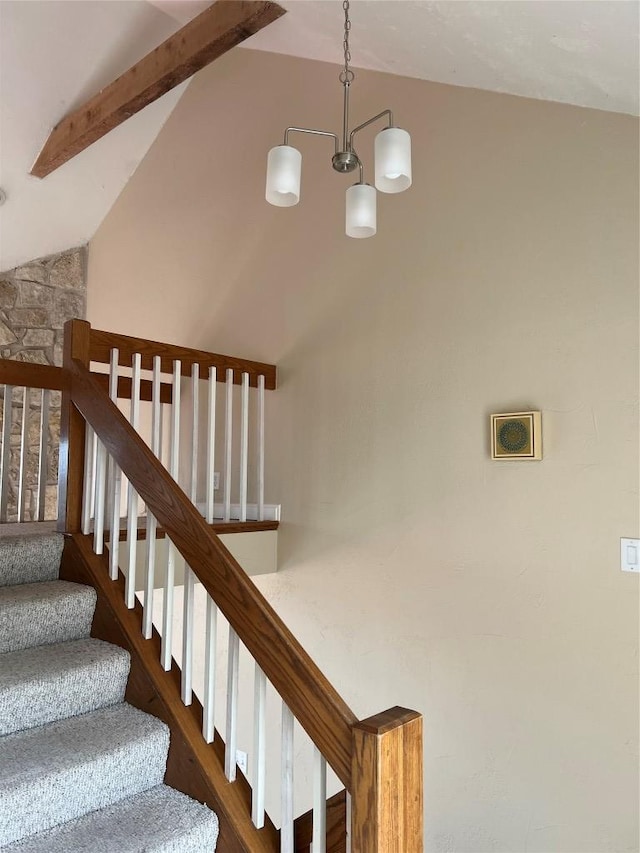 stairway featuring beam ceiling and high vaulted ceiling