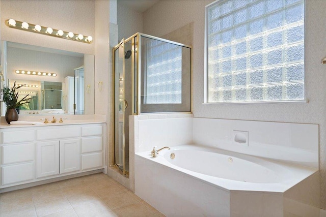 13601 Lone Rider Trl, Austin, TX 78738 - bathroom with a garden tub, vanity, a shower stall, and tile patterned flooring