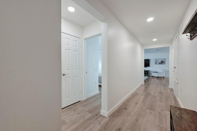 7004 Ashen Ln, Austin, TX 78747 - hall featuring light wood-type flooring and recessed lighting