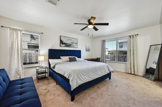 7004 Ashen Ln, Austin, TX 78747 - carpeted bedroom with baseboards and a ceiling fan