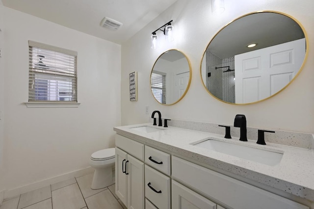 7004 Ashen Ln, Austin, TX 78747 - full bath with tiled shower, double vanity, and tile patterned floors