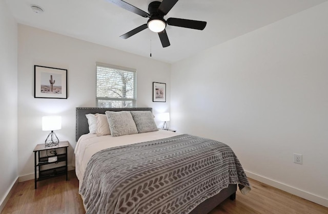 7004 Ashen Ln, Austin, TX 78747 - bedroom featuring wood finished floors and a ceiling fan