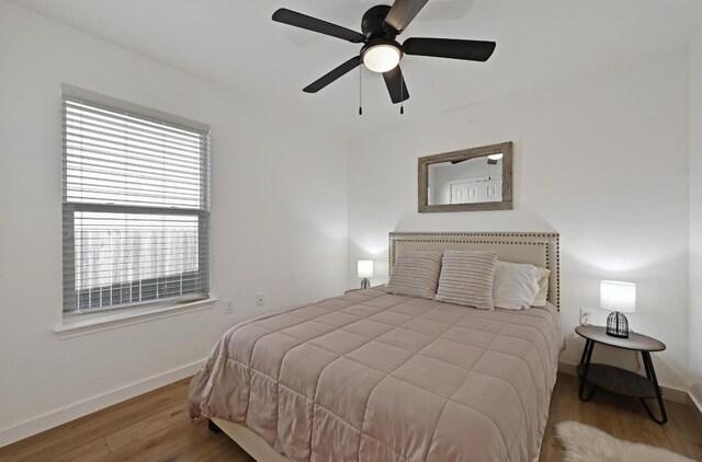 7004 Ashen Ln, Austin, TX 78747 - bedroom featuring wood finished floors and a ceiling fan