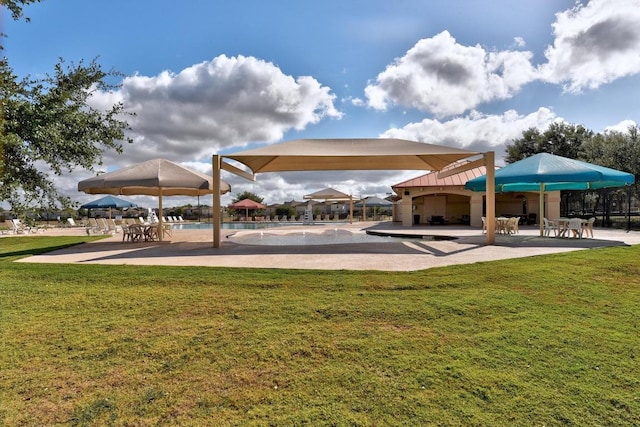 7004 Ashen Ln, Austin, TX 78747 - view of property's community featuring a patio, a swimming pool, and a lawn