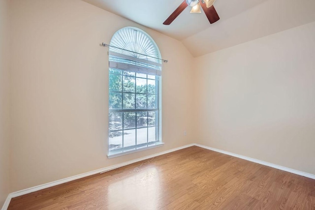 2708 Winding Brook Dr, Austin, TX 78748 - empty room featuring wood finished floors, lofted ceiling, a ceiling fan, and baseboards
