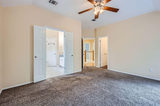 2708 Winding Brook Dr, Austin, TX 78748 - unfurnished bedroom featuring carpet flooring, lofted ceiling, baseboards, ensuite bath, and ceiling fan