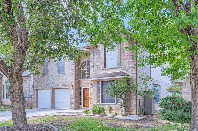 2708 Winding Brook Dr, Austin, TX 78748 - view of front of home with concrete driveway, a garage, and brick siding