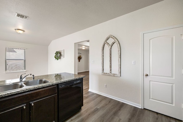 kitchen featuring dark wood-style floors, visible vents, a sink, black dishwasher, and a textured ceiling
