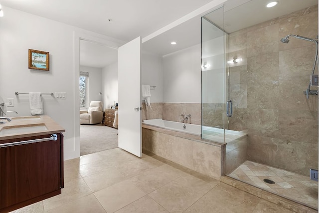 210 Lee Barton Dr Unit 308, Austin, TX 78704 - full bath with a garden tub, vanity, recessed lighting, tile patterned floors, and a shower stall